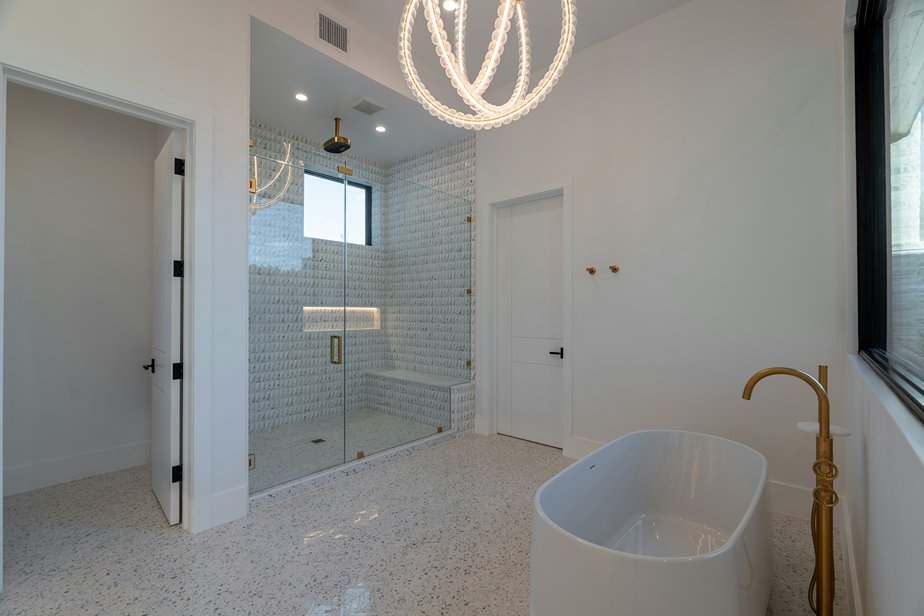 A finished frameless shower with bulstrades